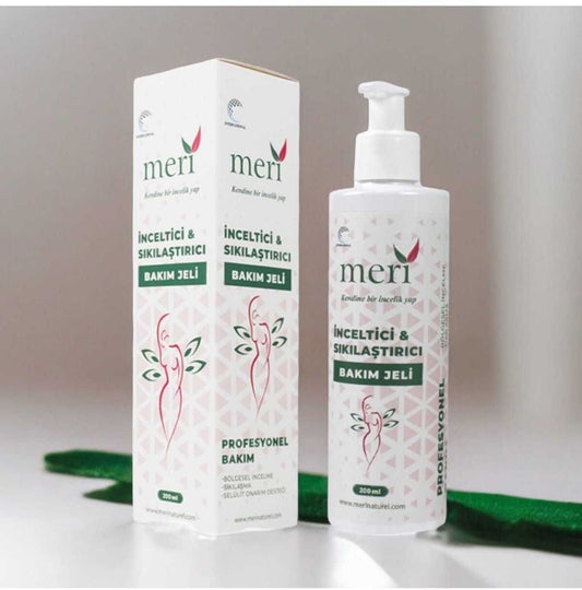 Meri Gel bottle with a pump dispenser, placed on a bathroom shelf beside a small towel and green plant.